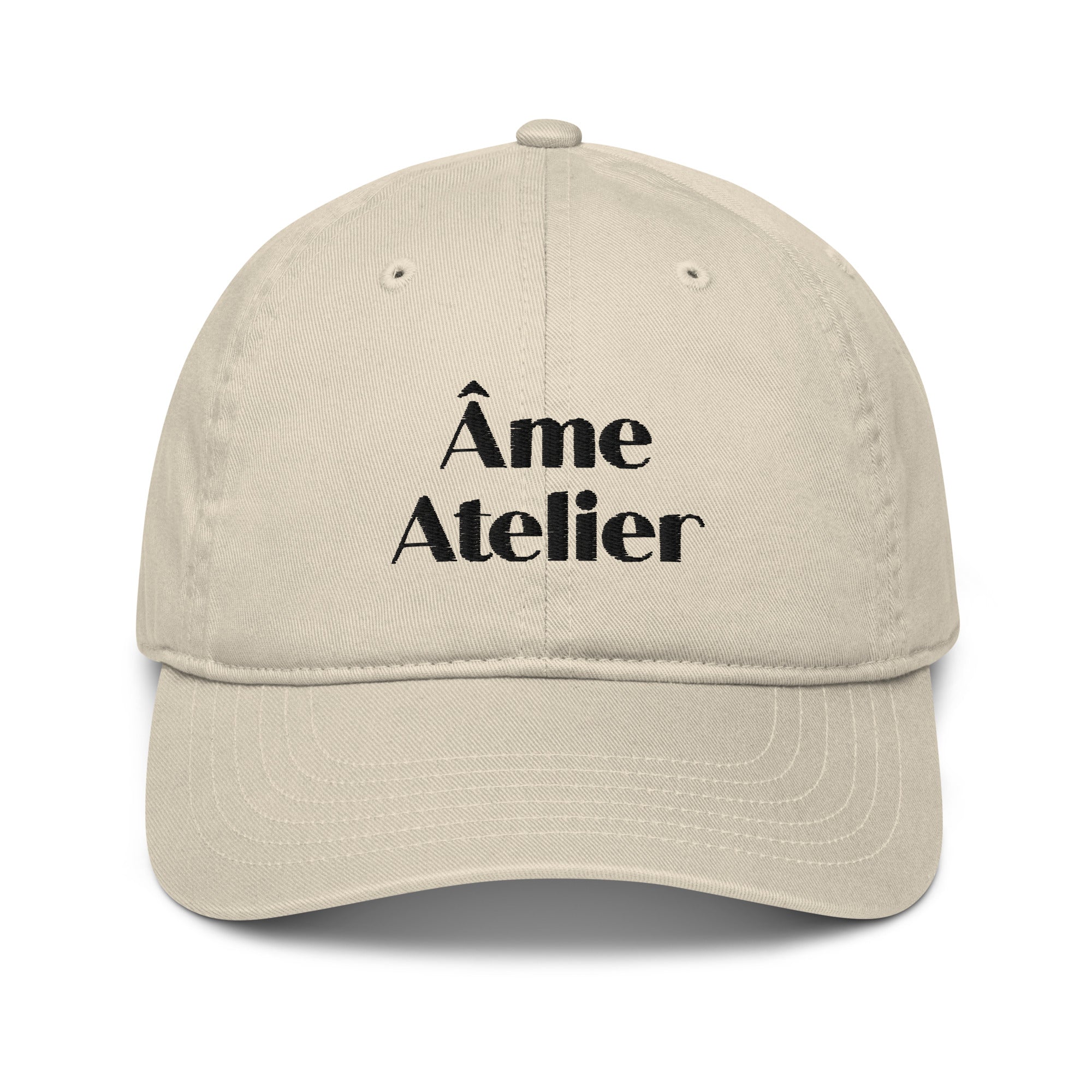 Front view of Âme Atelier signature beige cap in organic cotton