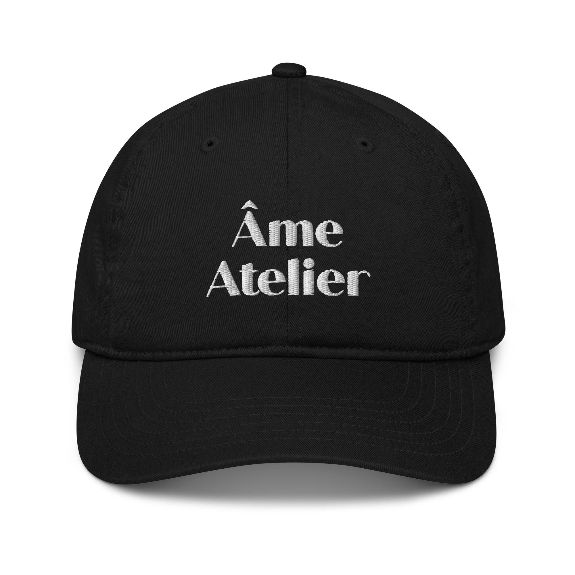 Front view of Âme Atelier signature black cap in organic cotton