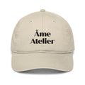 Front view of Âme Atelier signature beige cap in organic cotton