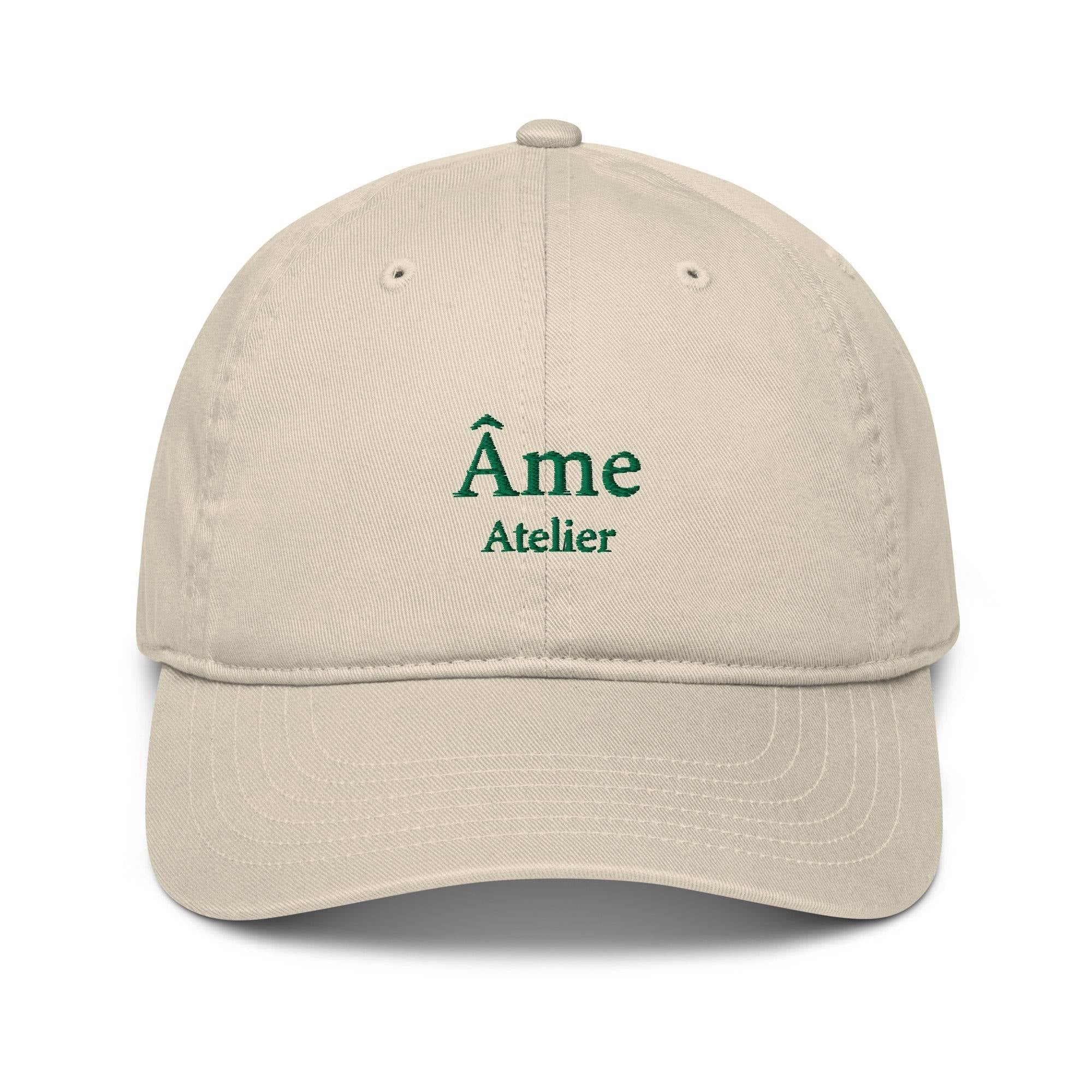 Front view of Âme Atelier embroidered cap in beige