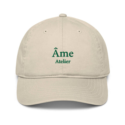 Front view of Âme Atelier embroidered cap in beige