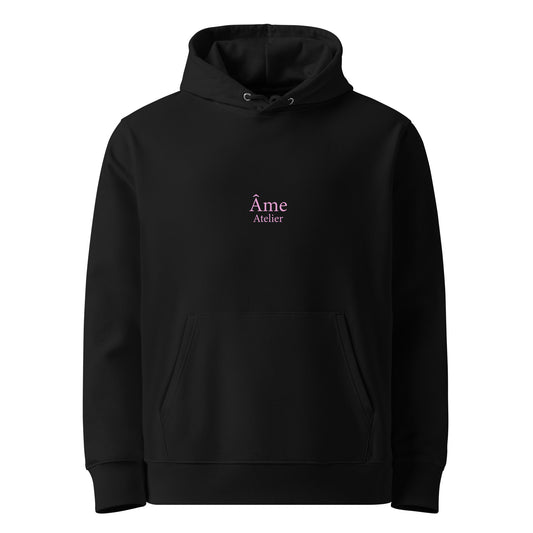 Front view of Âme Atelier Club organic cotton hoodie in black with powder pink details