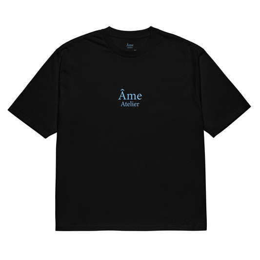 Front view of Âme Atelier Club oversized t-shirt in black with frozen blue details