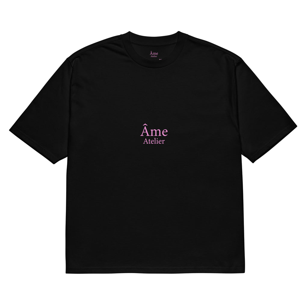 Front view of Âme Atelier Club oversized t-shirt in black with powder pink details
