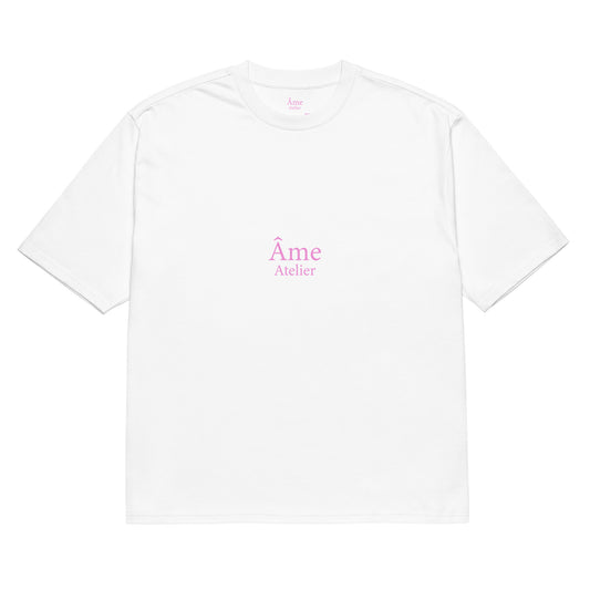 Front view of Âme Atelier Club oversized t-shirt in white with powder pink details