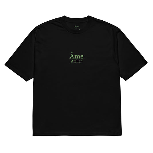 Front view of Âme Atelier Club oversized t-shirt in black with pistachio details