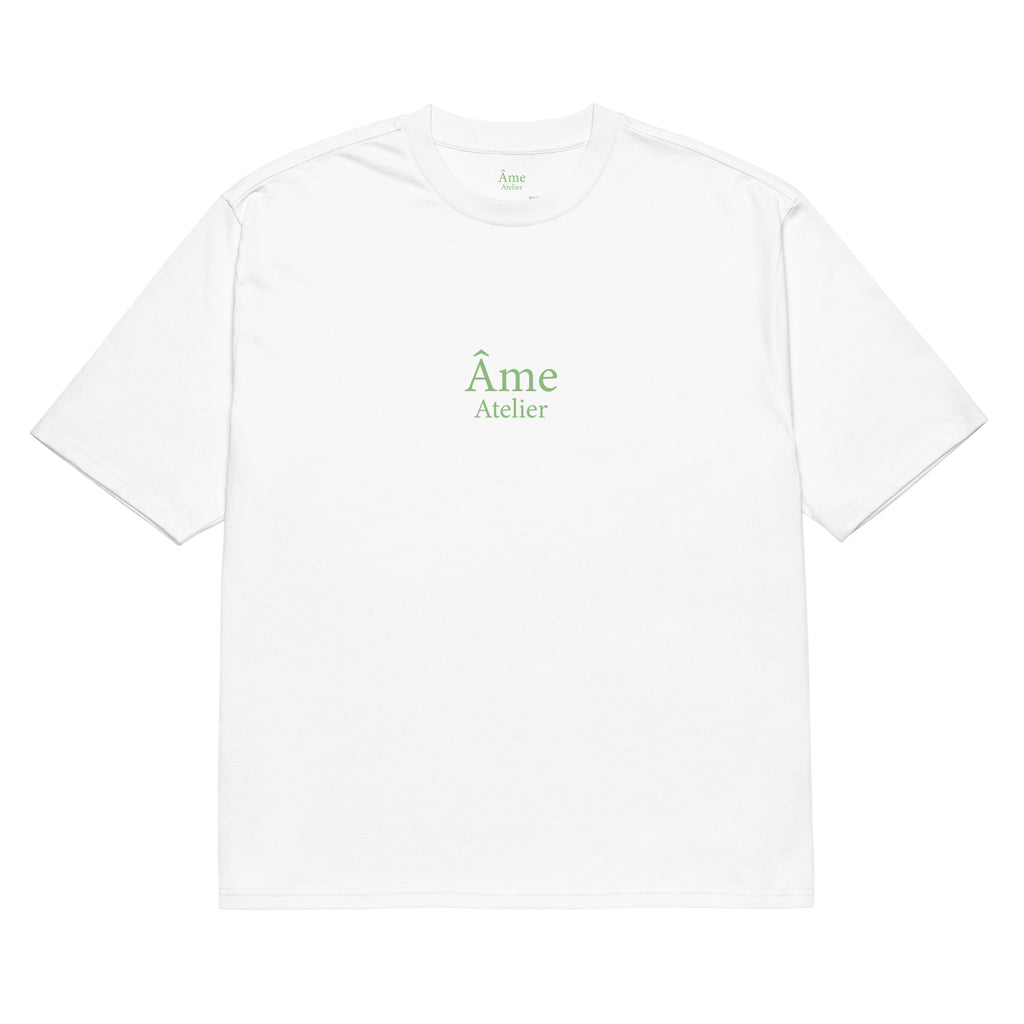 Front view of Âme Atelier Club oversized t-shirt in white with pistachio details