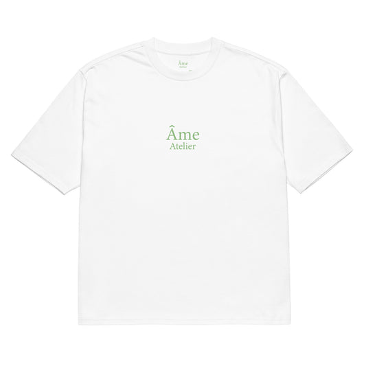 Front view of Âme Atelier Club oversized t-shirt in white with pistachio details