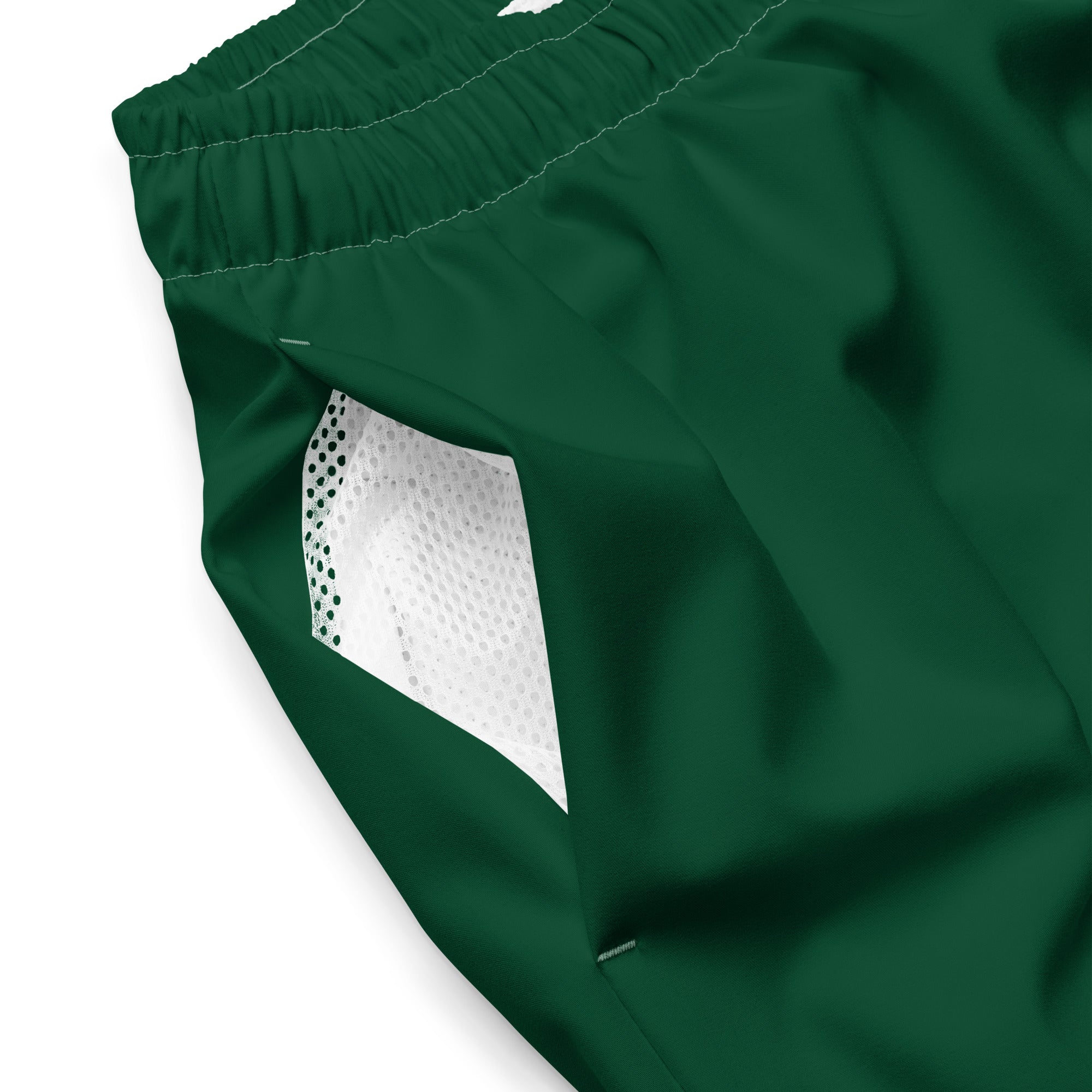 Close up of Âme Atelier swimming shorts in abyss green
