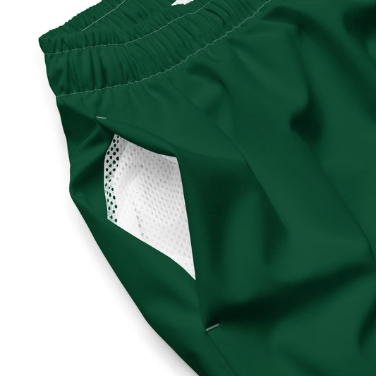 Close up of Âme Atelier swimming shorts in abyss green