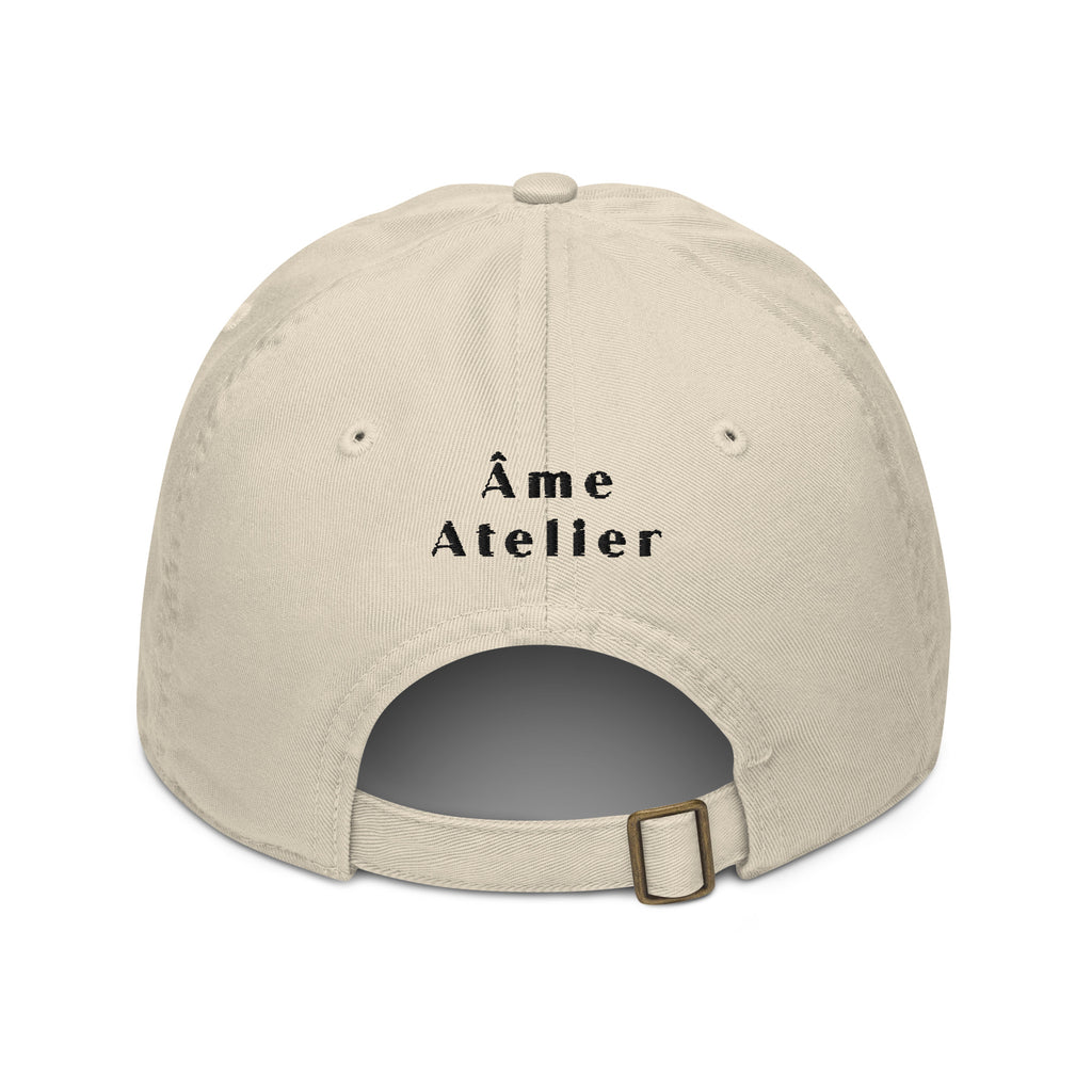Back view of Black Sun beige cap in organic cotton with an embroidered black sun