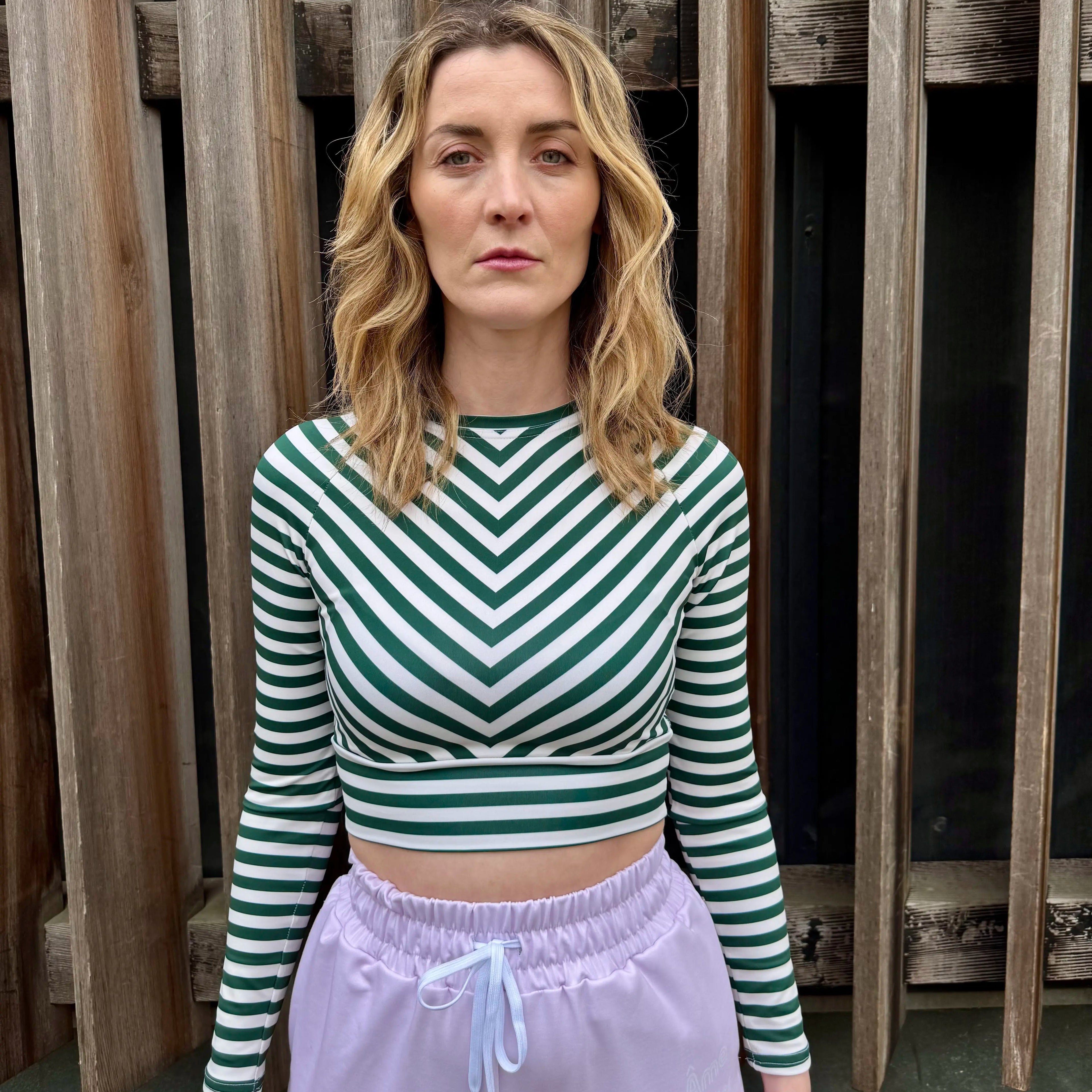 Model wearing L'hypnotique crop top in abyss green