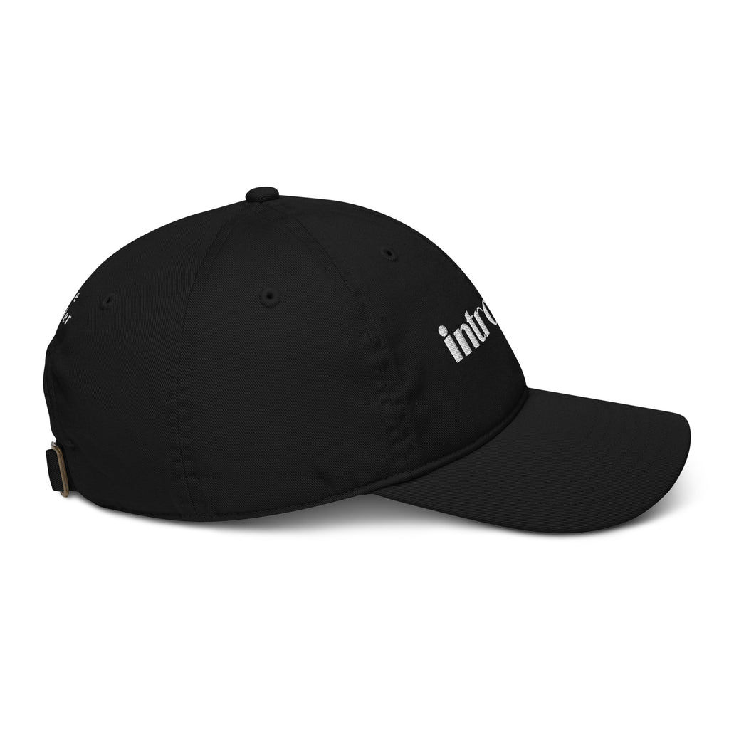 Side view of Introvert black cap in organic cotton with the word introvert embroidered