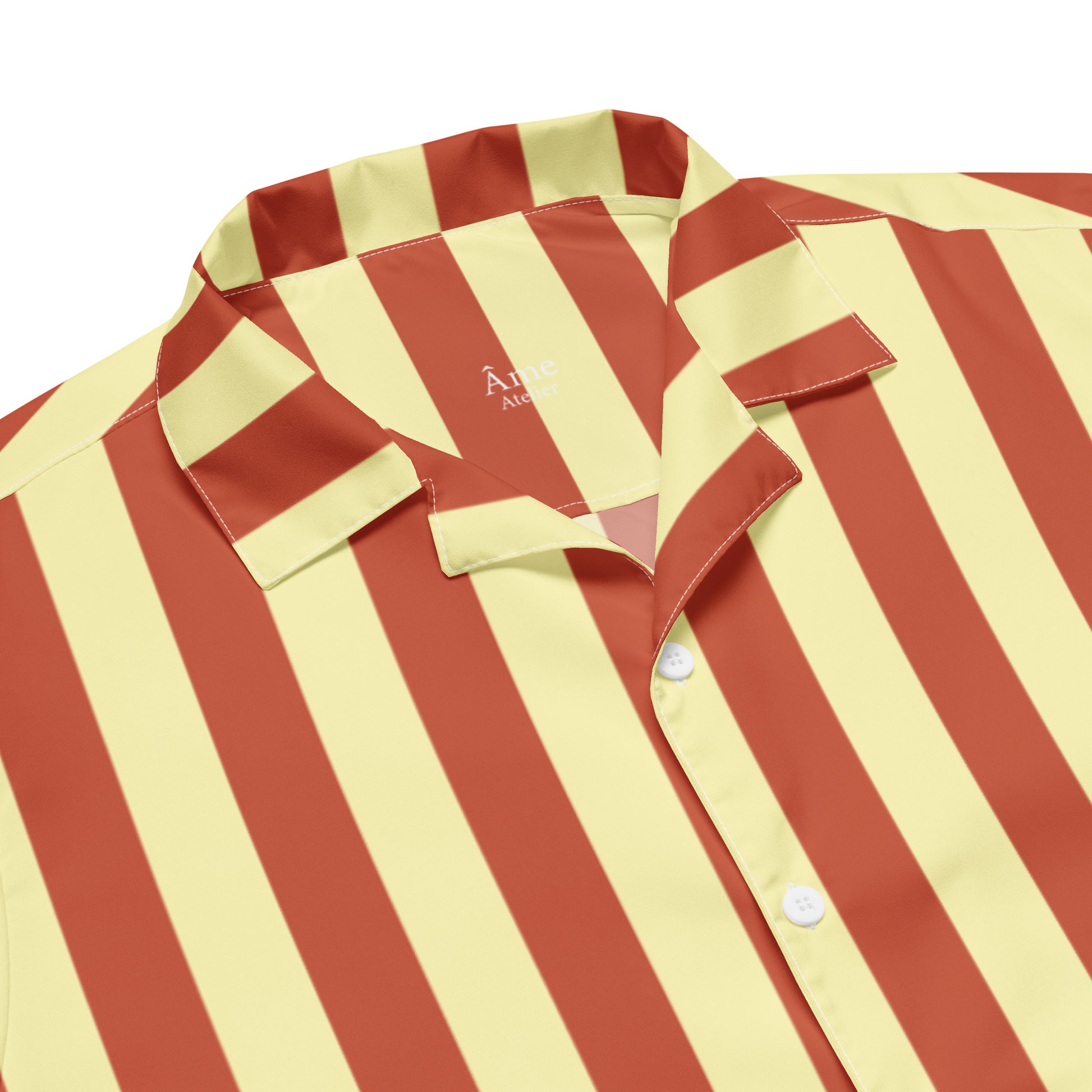 Close up of La Vibrante striped shirt in terracotta and soft yellow