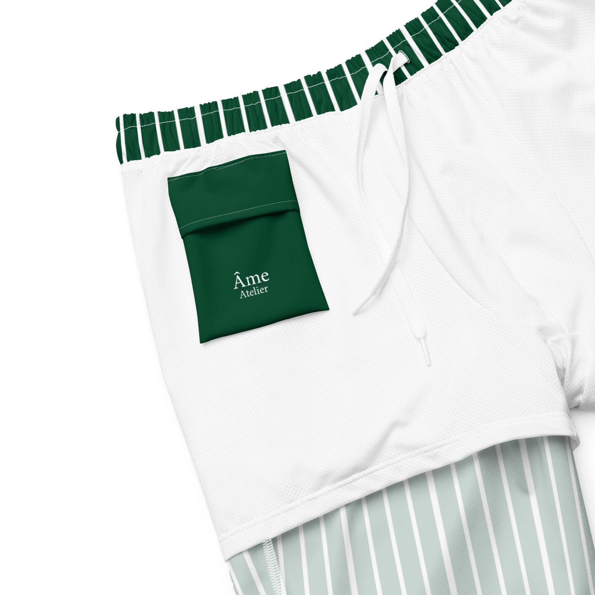 Inside pocket of Le Rayé striped swimming shorts in abyss green