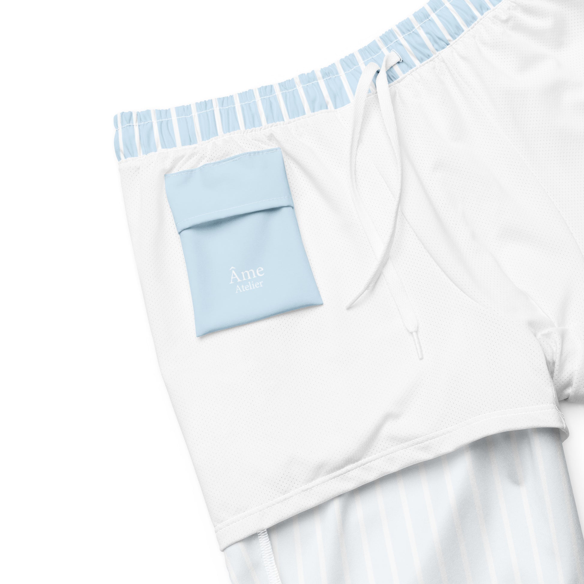 Inside pocket of Le Rayé striped swimming shorts in frozen blue