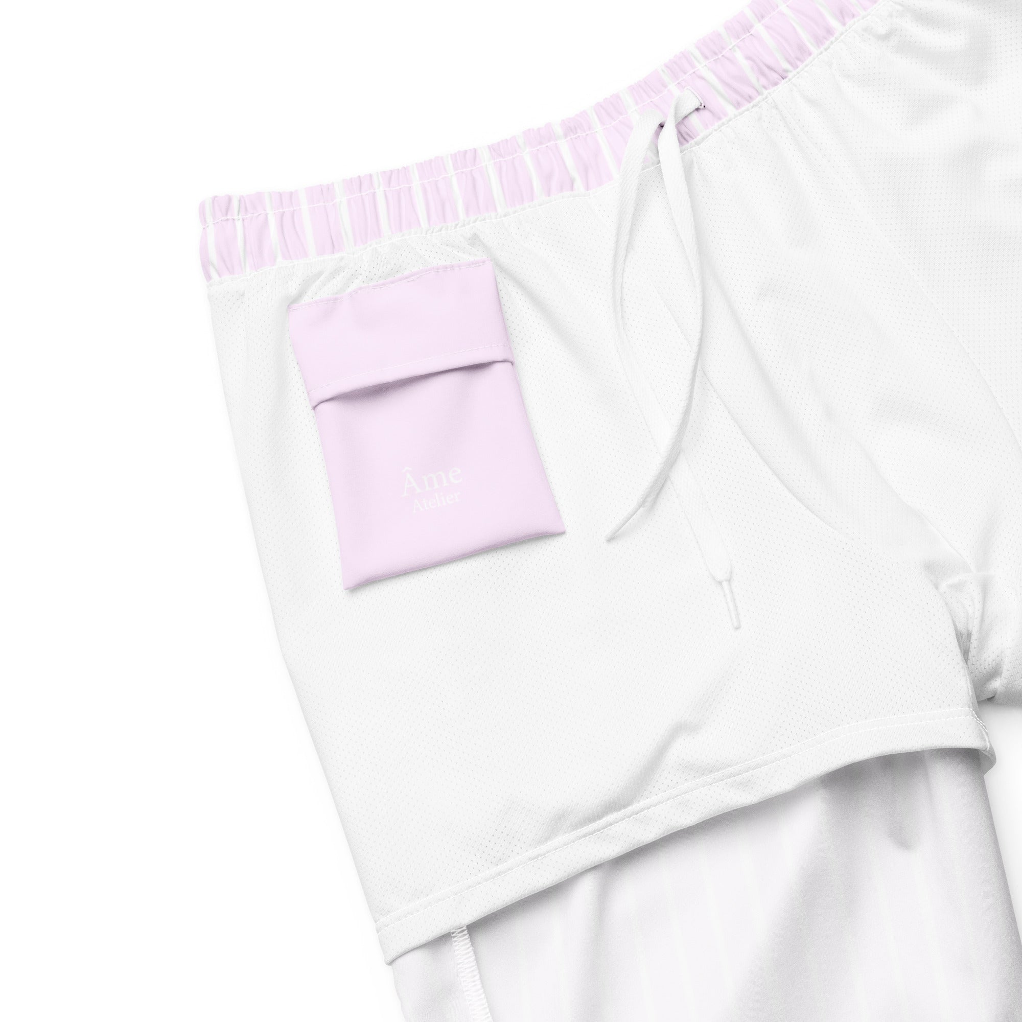 Inside pocket of Le Rayé striped swimming shorts in powder pink