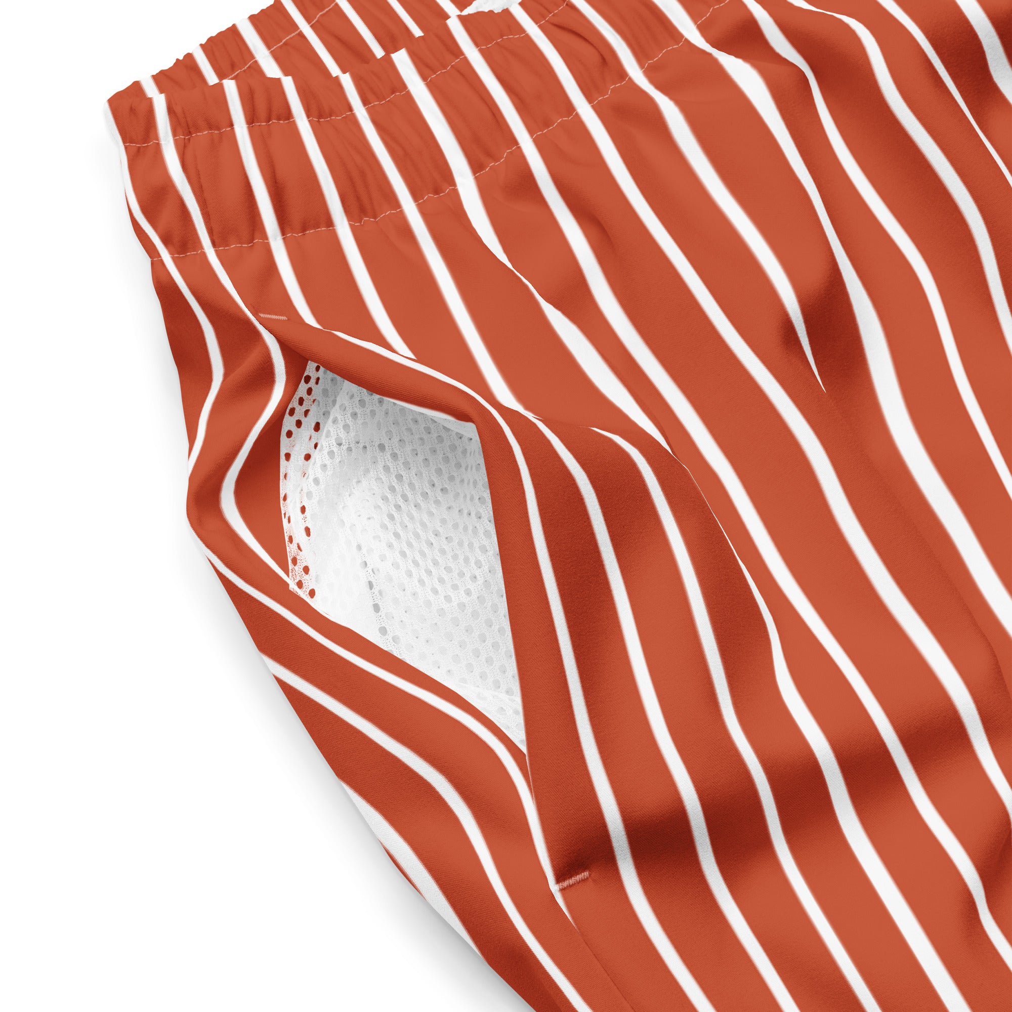 Close up of Le Rayé striped swimming shorts in terracotta