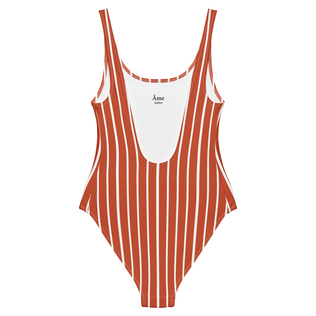 Back view of Le Rayé striped swimsuit in terracotta