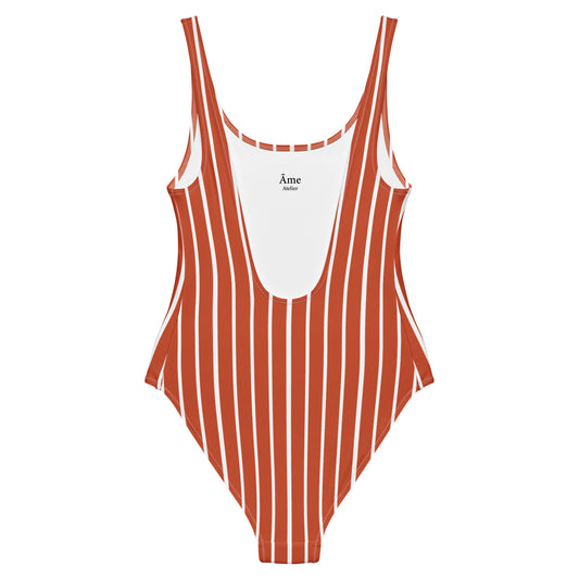 Back view of Le Rayé striped swimsuit in terracotta