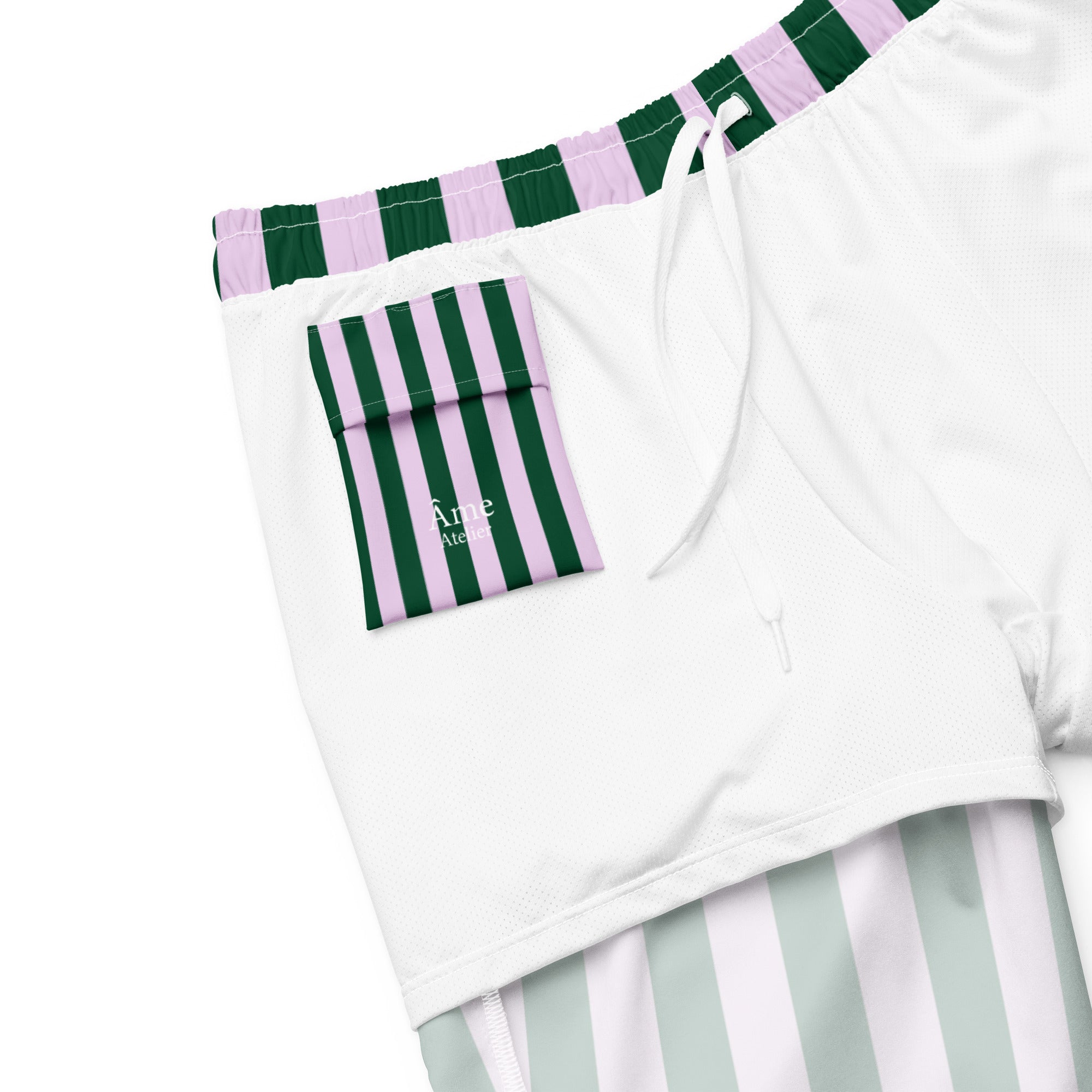 Inside pocket of Le Vibrant striped swimming shorts in abyss green and powder pink