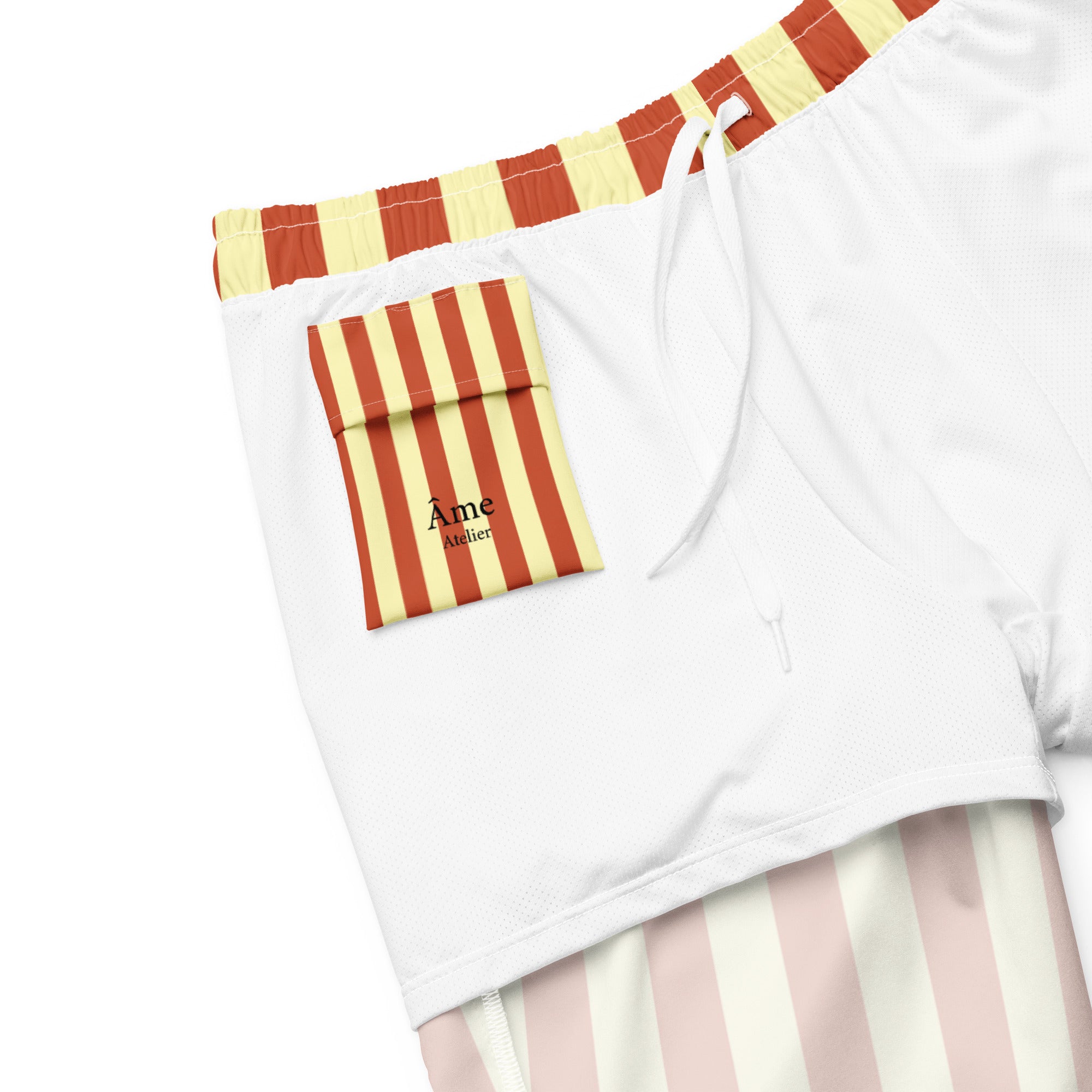 Inside pocket of Le Vibrant striped swimming shorts in terracotta and soft yellow