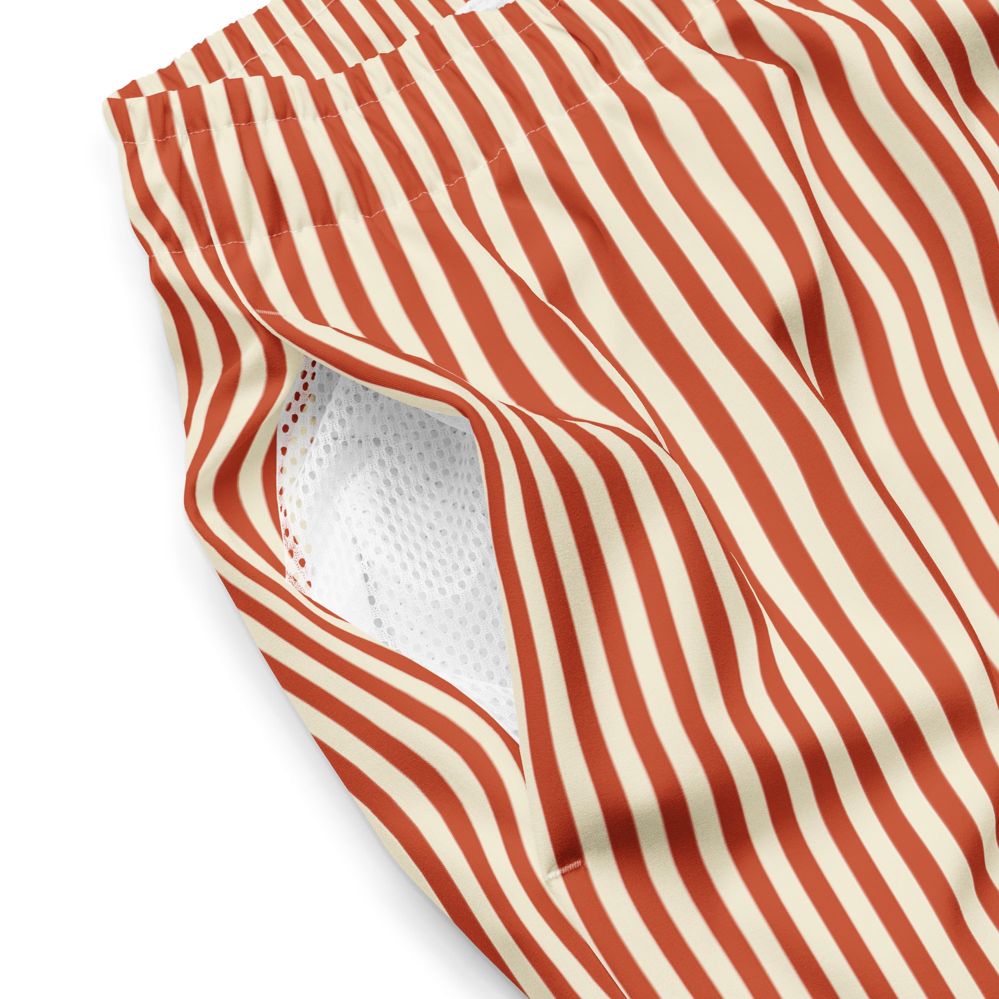 Close up of L'hypnotique striped swimming shorts in terracotta