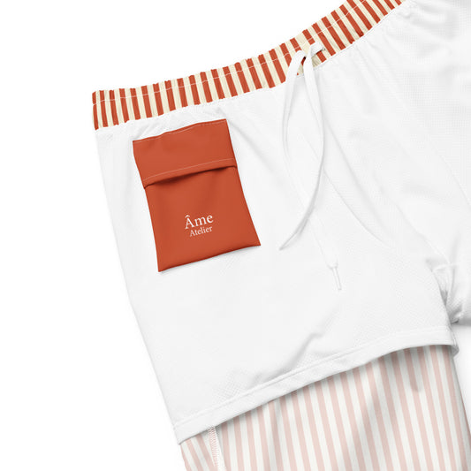Inside pocket of L'hypnotique striped swimming shorts in terracotta