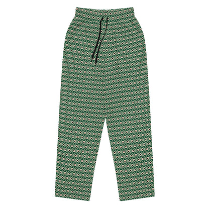 Front view of L'œil de paon pants in abyss green with peacock pattern