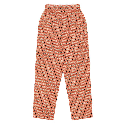 Back view of L'œil de paon pants in terracotta with peacock pattern