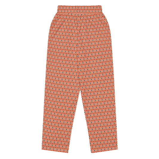 Back view of L'œil de paon pants in terracotta with peacock pattern