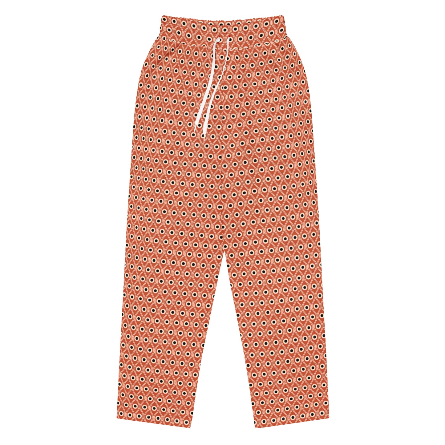 Front view of L'oeil de paon pants in terracotta with peacock pattern