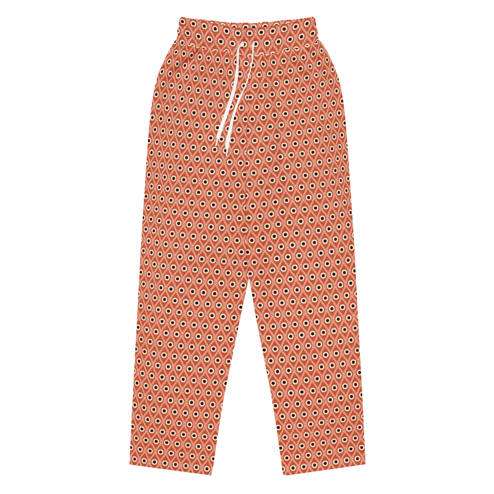 Front view of L'oeil de paon pants in terracotta with peacock pattern