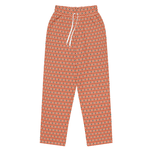 Front view of L'oeil de paon pants in terracotta with peacock pattern