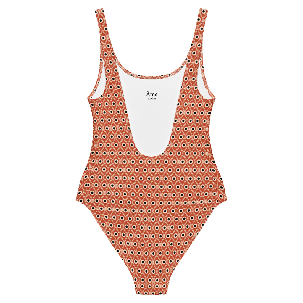 Back view of L'œil de paon peacock-print swimsuit in terracotta