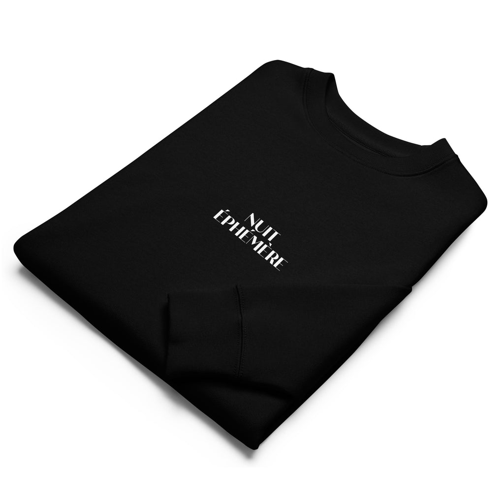 Folded view of Nuit Éphémère black sweatshirt in organic cotton with a printed moon