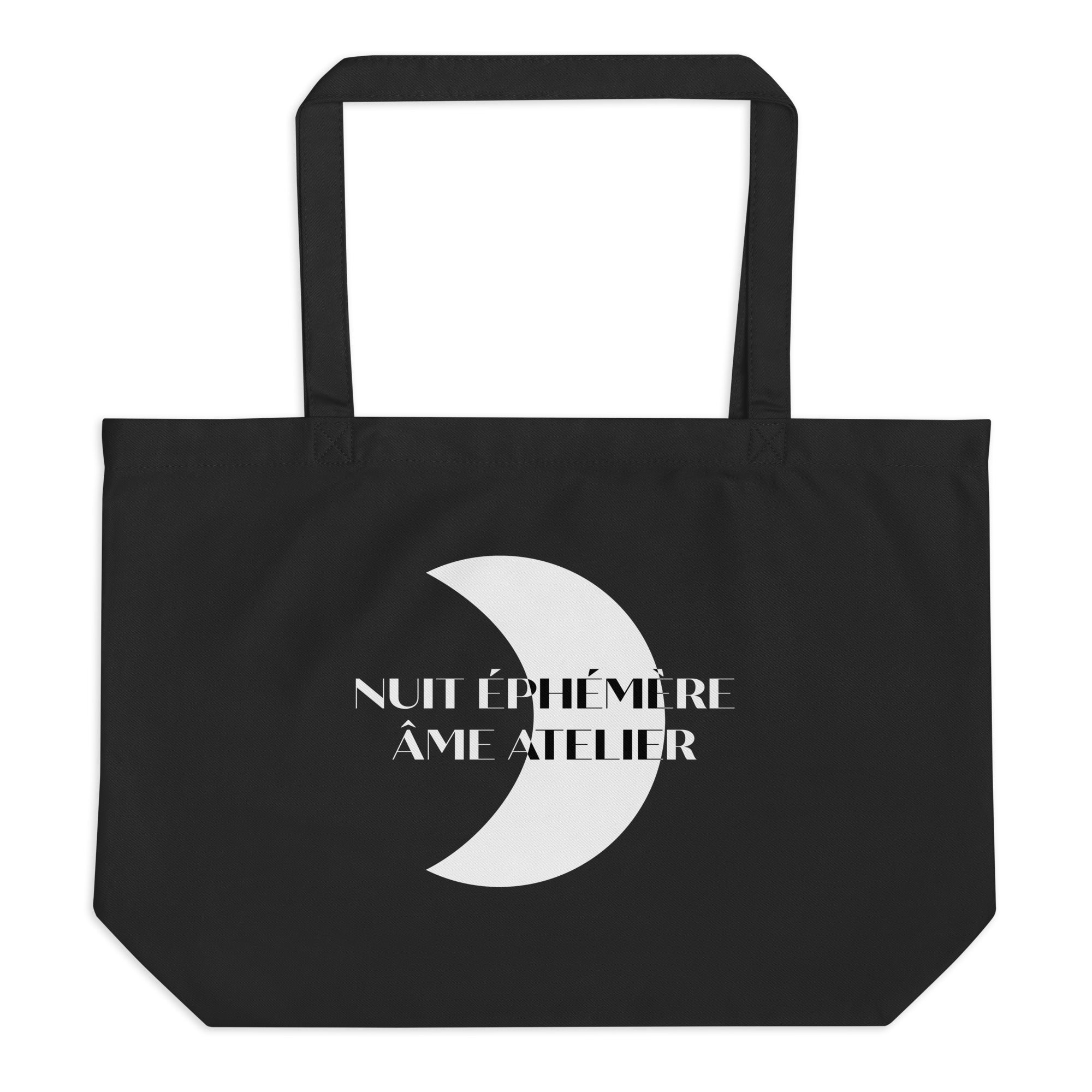 Front view of Nuit Éphémère organic cotton tote bag with a moon printed on the front and Âme Atelier logo on the back