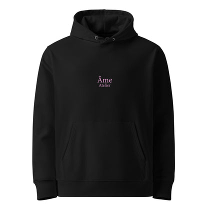 Front view of Pleasure organic cotton hoodie in black with powder pink print
