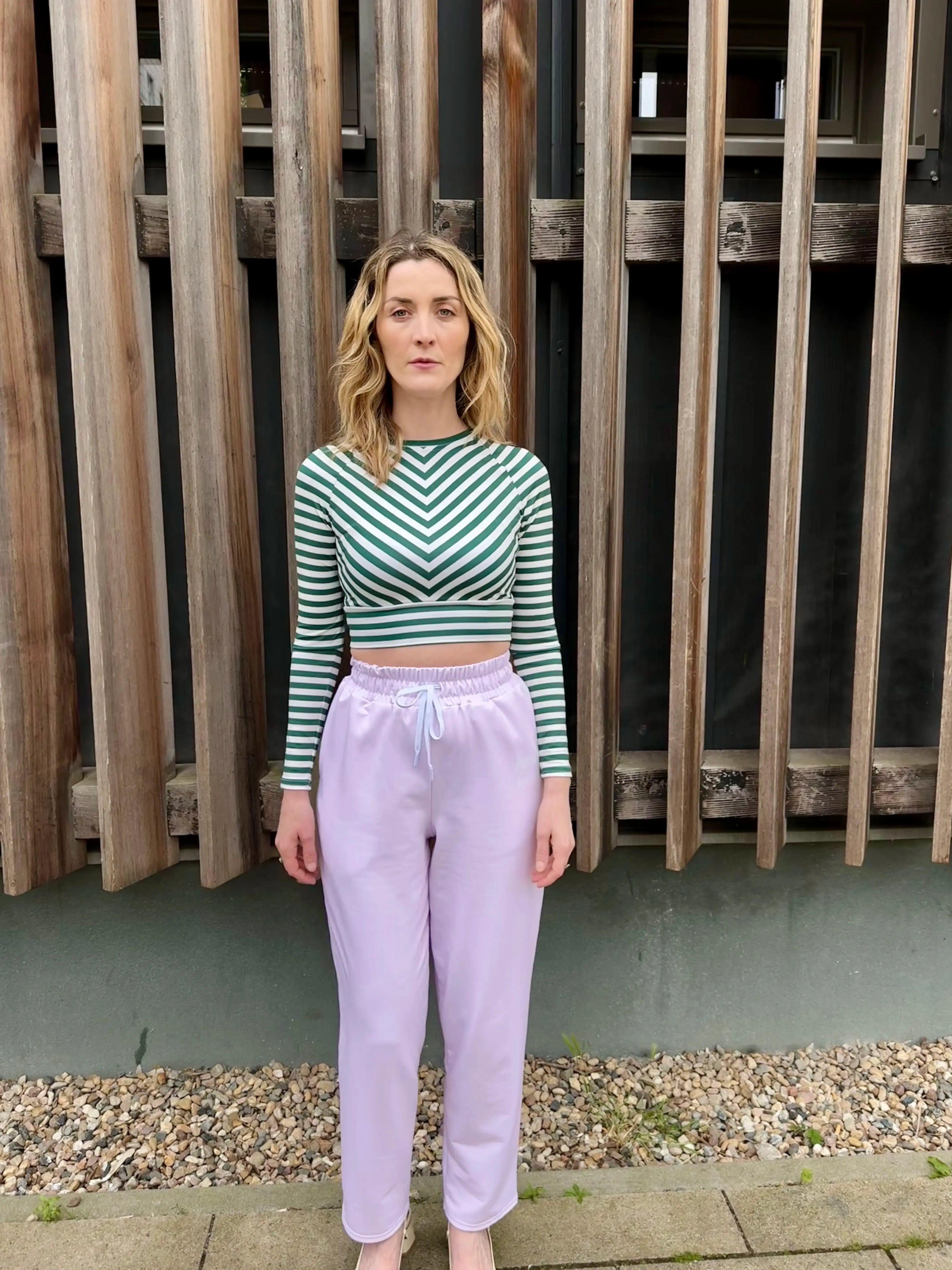 Video of model wearing Le Cosy trousers in powder pink